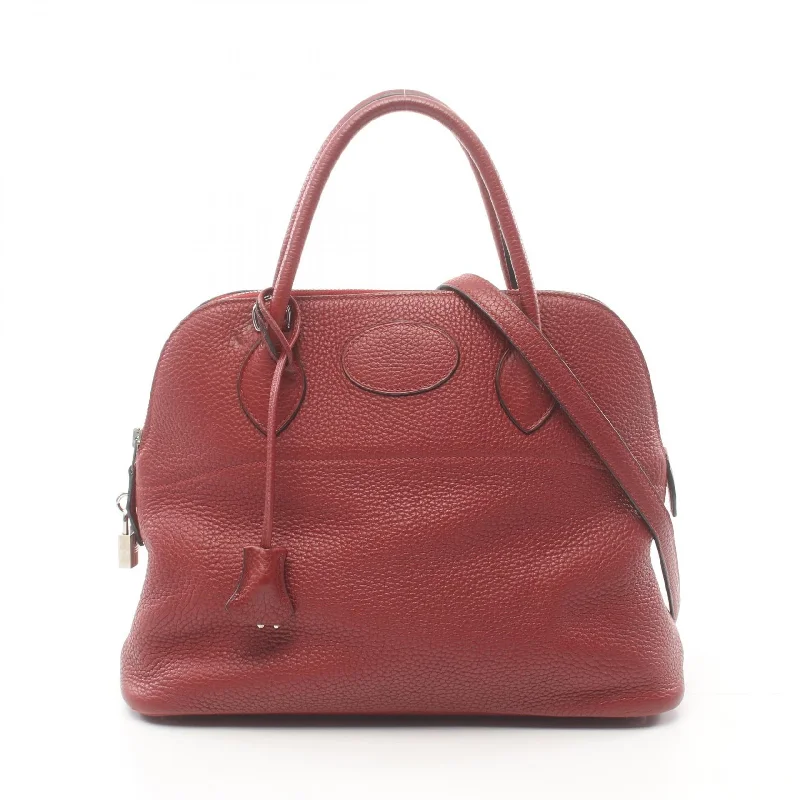 Handle bags with playful pom-poms for charm -Hermes Bolide 31 Handbag Bordeaux