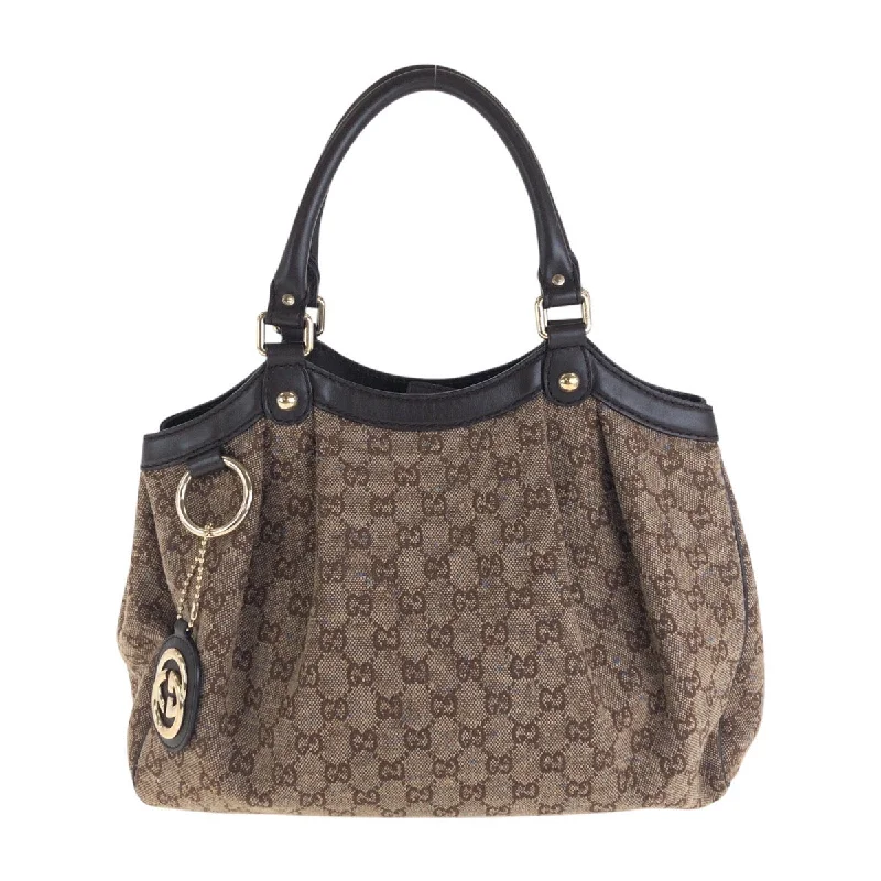 Handle bags with metallic finishes for shine -Gucci Sukey GG Canvas Leather Handbag